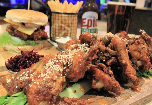 Two Burgers with Fries or Large Servings of Chicken Wings or BBQ Pork Ribs Matched with Two Craft Beers or House Wines – Options for up to Eight People
