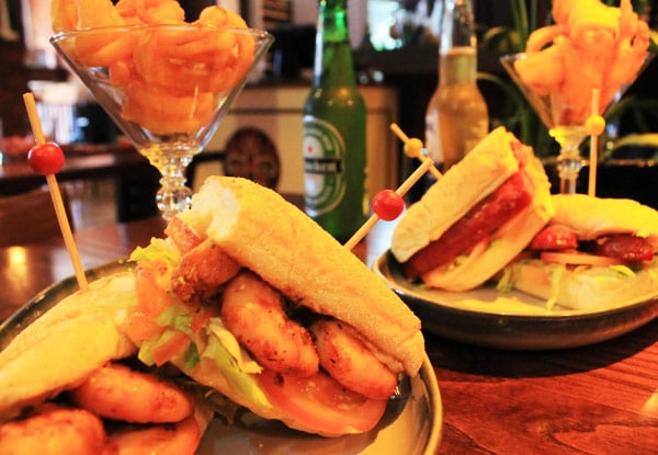 $16 for Your Choice of Authentic New Orleans Cajun Po' Boy with Curly Fries & a Beer - Options for up to Four People (value up to $99)