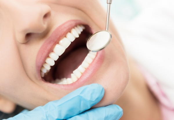 40-60 Minute Laser Teeth Whitening Session & Full Mouth Exam for One Person