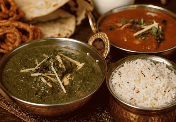 Curry Dinner for Two People incl. Two Curries, Shared Rice, One Naan & One Onion Bhaji